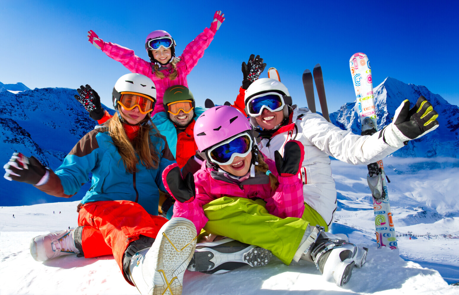 Skiing, panorama - family enjoying winter vacation